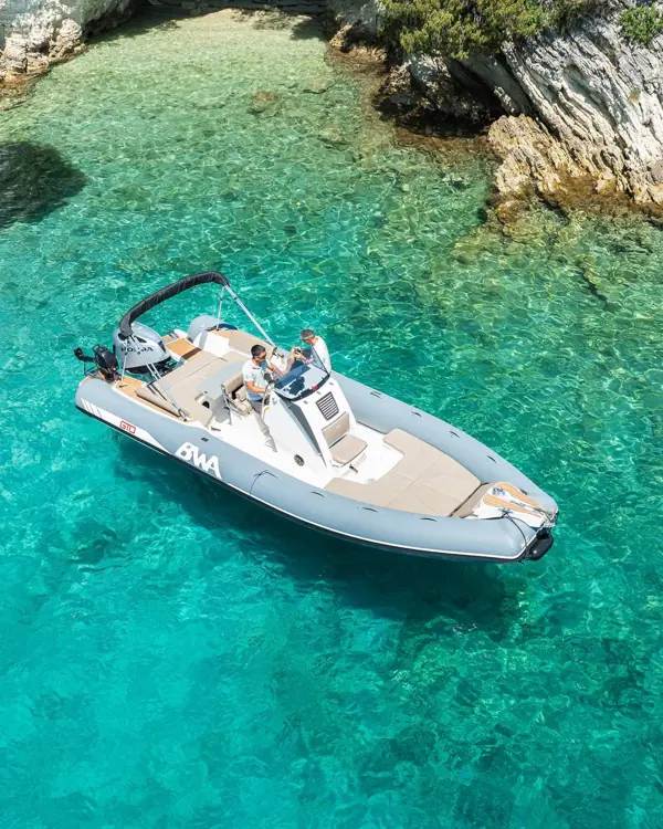 Rental speedboat on clear turquoise water